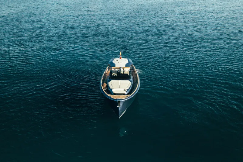  Yacht Photos Pics 2023 Solaris Power 44 Open yacht on calm blue water, aerial view.