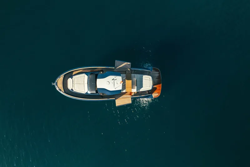  Yacht Photos Pics Aerial view of 2023 Solaris Power 44 Open yacht on calm water.