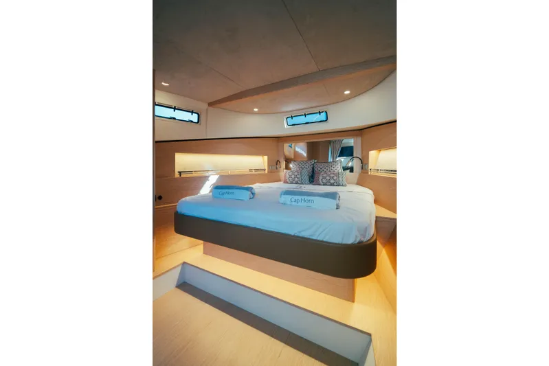  Yacht Photos Pics Luxurious interior cabin of 2023 Solaris Power 44 Open yacht with elegant bedding.