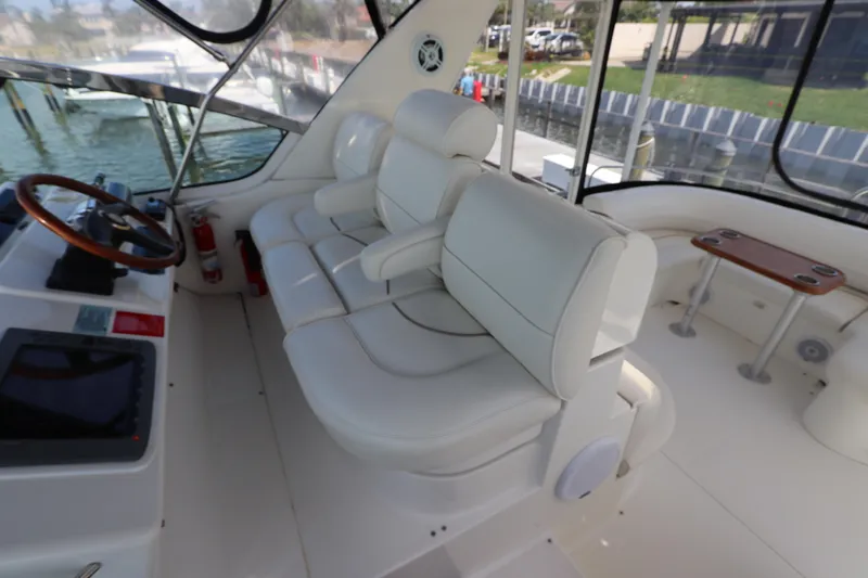  Yacht Photos Pics Luxurious interior of 2000 Cruisers Yachts 4450 Express Motoryacht with plush white seating.