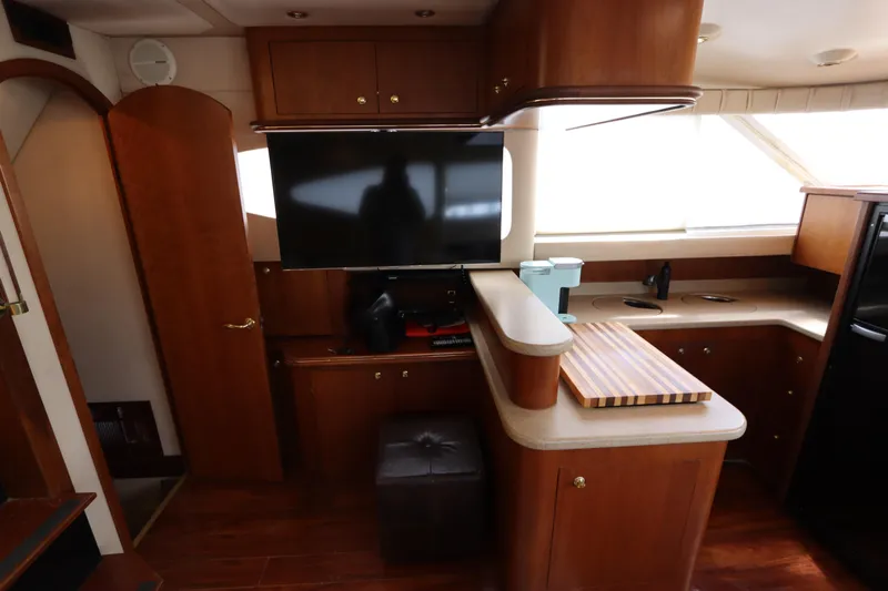  Yacht Photos Pics Interior of 2000 Cruisers Yachts 4450 Express Motoryacht with wood cabinetry and modern amenities.