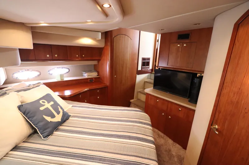  Yacht Photos Pics Luxurious cabin interior of 2000 Cruisers Yachts 4450 Express Motoryacht with nautical decor.