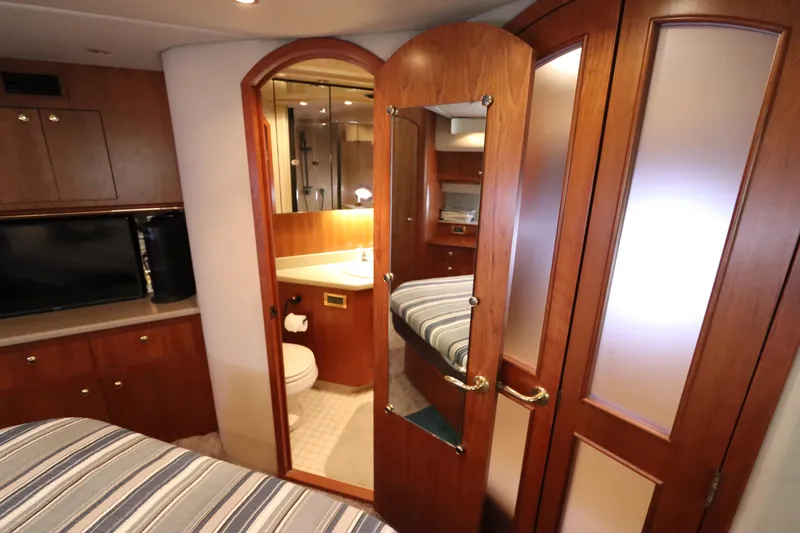  Yacht Photos Pics Interior of 2000 Cruisers Yachts 4450 Express Motoryacht with wood cabinetry and bathroom.