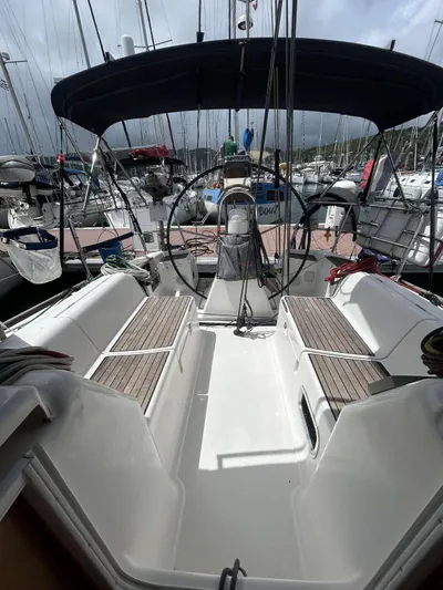  Yacht Photos Pics 2006 Dufour 34 Performance sailboat cockpit with dual steering wheels and teak seating.