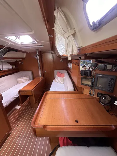  Yacht Photos Pics Interior of 2006 Dufour 34 Performance sailboat with wooden furnishings and navigation equipment.