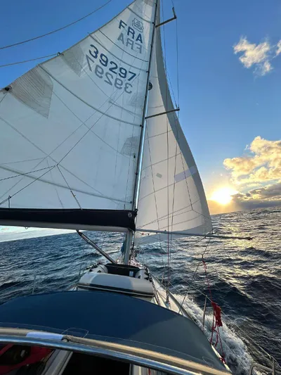  Yacht Photos Pics Sailing Dufour 34 Performance yacht at sunset, 2006 model, on open sea.