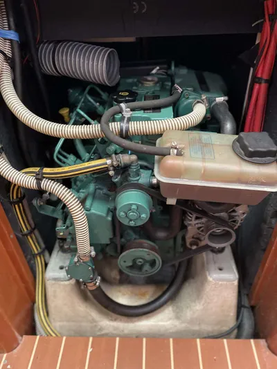  Yacht Photos Pics Engine compartment of a 2006 Dufour 34 Performance sailboat, showcasing detailed mechanical components.