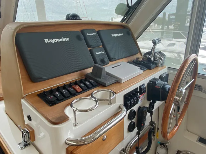  Yacht Photos Pics 2014 Back Cove 41 helm with Raymarine electronics and wooden steering wheel.