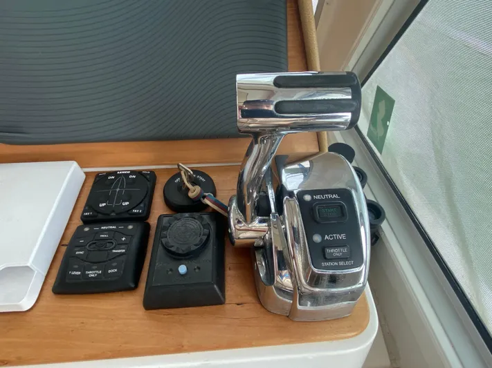  Yacht Photos Pics Control panel of a 2014 Back Cove 41 boat, featuring throttle and switches.