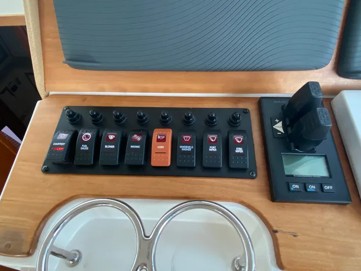  Yacht Photos Pics Control panel of a 2014 Back Cove 41 boat with switches and display.