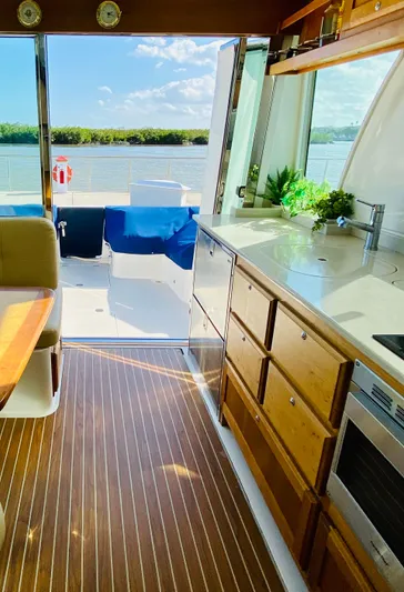  Yacht Photos Pics Interior of 2014 Back Cove 41 yacht with wooden flooring and modern kitchen.