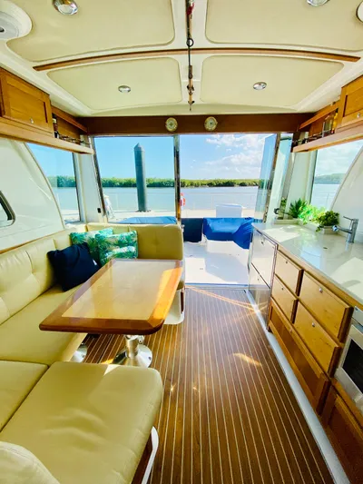  Yacht Photos Pics Luxurious interior of a 2014 Back Cove 41 yacht with elegant wood finishes and scenic views.