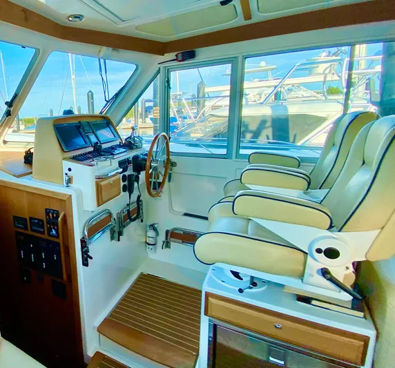  Yacht Photos Pics Interior of 2014 Back Cove 41 boat with helm, controls, and seating.