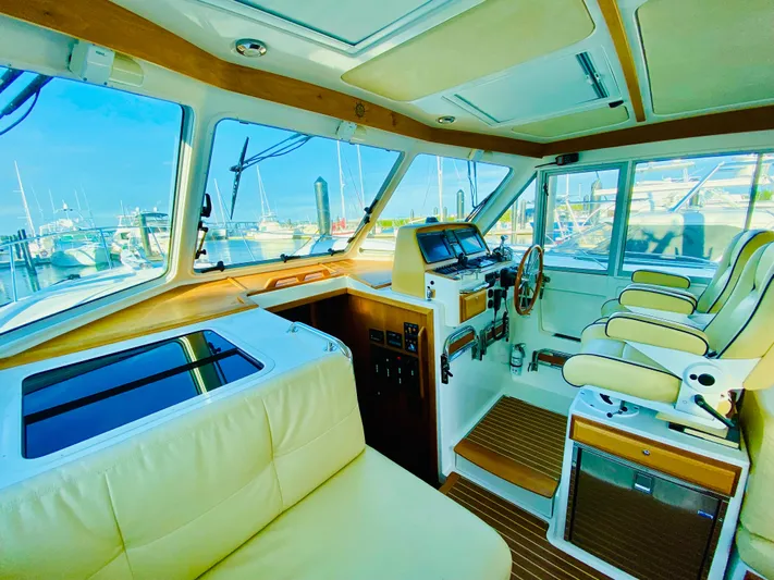  Yacht Photos Pics Interior of 2014 Back Cove 41 yacht with luxurious seating and navigation controls.