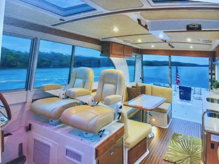  Yacht Photos Pics Luxurious interior of 2014 Back Cove 41 yacht with plush seating and scenic views.