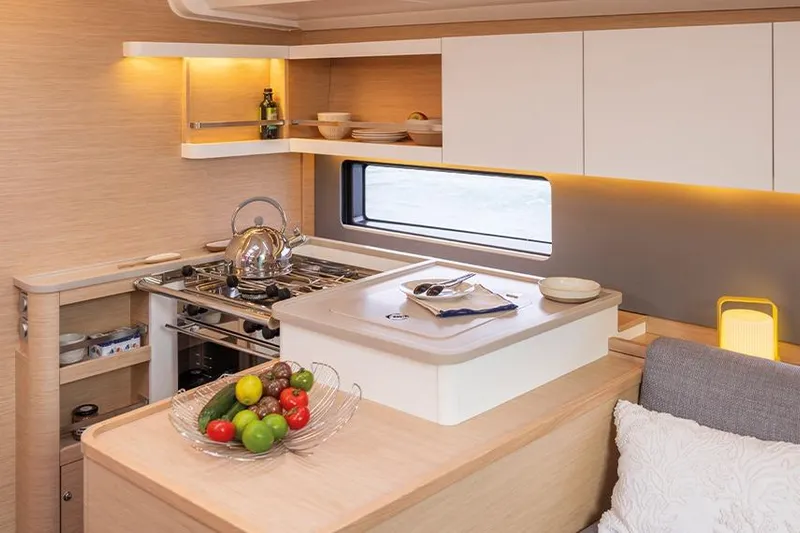  Yacht Photos Pics Modern kitchen interior of 2025 Dufour 44 yacht with sleek design and amenities.