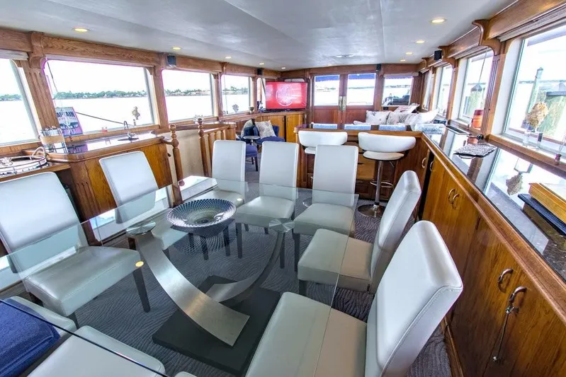 Timeless Yacht Photos Pics Luxurious interior of 1983 Benetti Custom Lloyds M.Y. yacht with modern dining area.