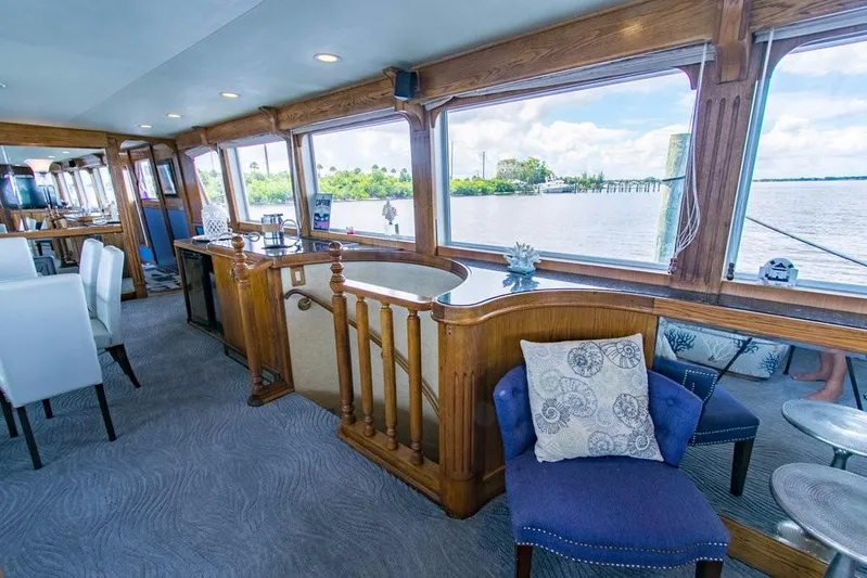 Timeless Yacht Photos Pics Luxurious interior of 1983 Benetti Custom Lloyds M.Y. yacht with scenic water views.