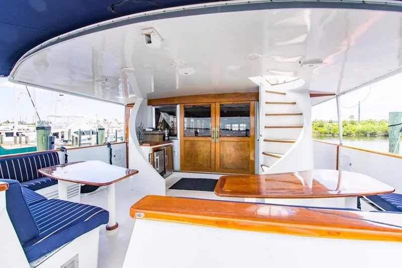 Timeless Yacht Photos Pics Benetti Custom Lloyds M.Y. 1983 yacht deck with seating and staircase.