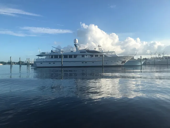 Timeless Yacht Photos Pics Benetti Custom Lloyds M.Y. 1983 yacht on calm water under blue sky.