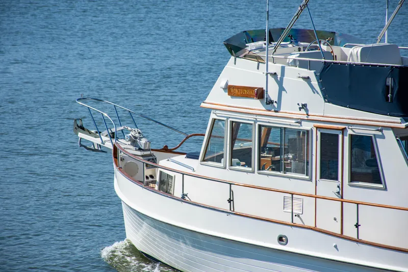  Yacht Photos Pics 1990 Grand Banks 36 Classic yacht cruising on calm blue waters.