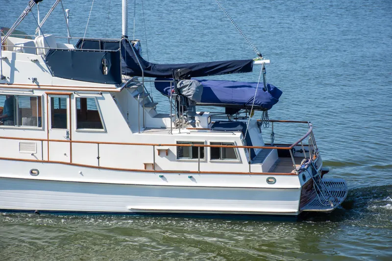  Yacht Photos Pics 1990 Grand Banks 36 Classic yacht cruising on calm waters.