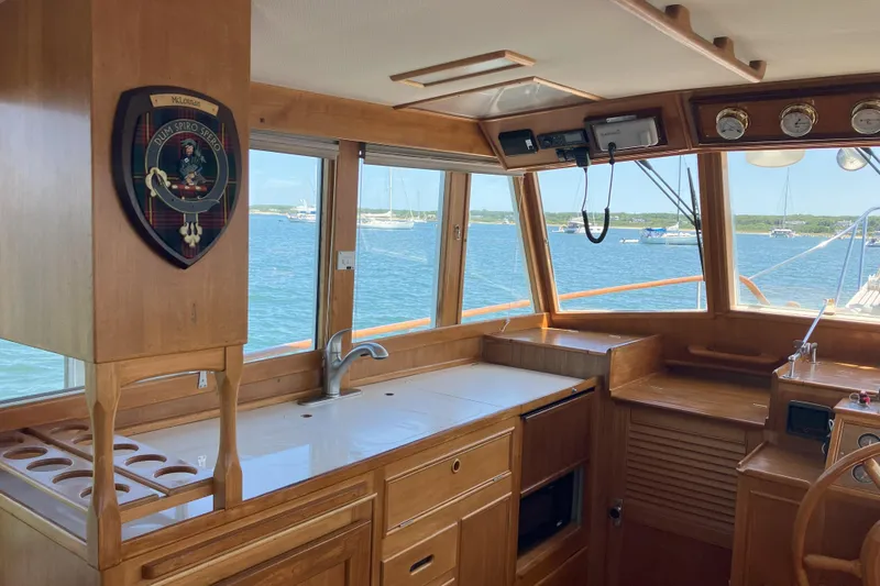 Yacht Photos Pics Interior of 1990 Grand Banks 36 Classic yacht with wooden cabinetry and ocean view.