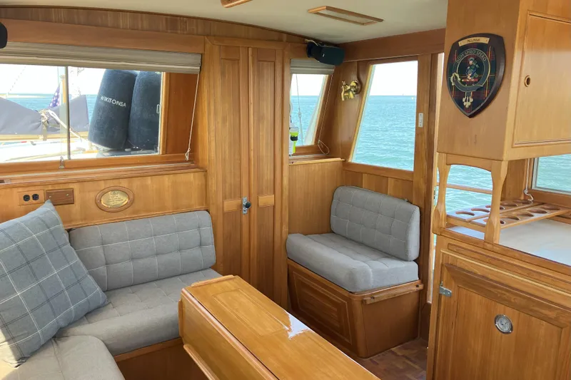 Yacht Photos Pics Interior of 1990 Grand Banks 36 Classic yacht with wooden furnishings and ocean view.
