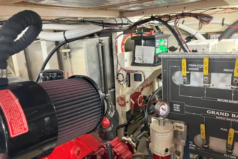  Yacht Photos Pics Engine room of a 1990 Grand Banks 36 Classic, showcasing detailed wiring and components.