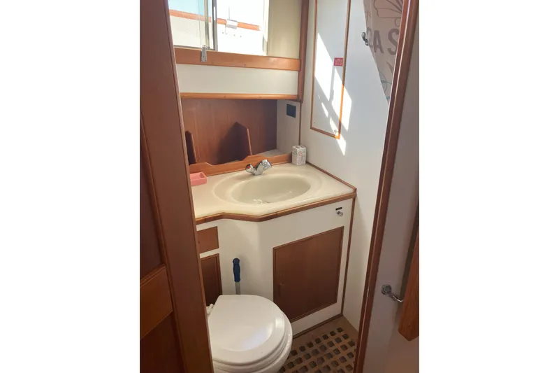  Yacht Photos Pics Bathroom interior of 1990 Grand Banks 36 Classic yacht with sink and toilet.