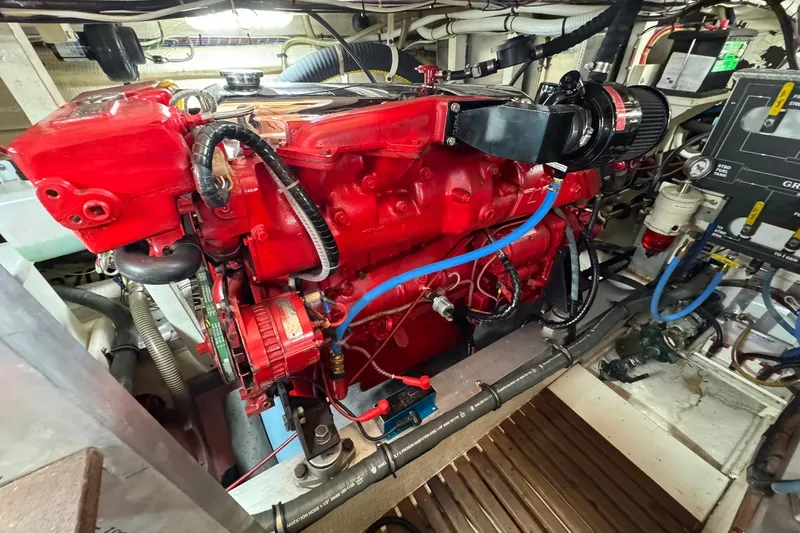  Yacht Photos Pics Engine room of 1990 Grand Banks 36 Classic with red engine components and wiring.
