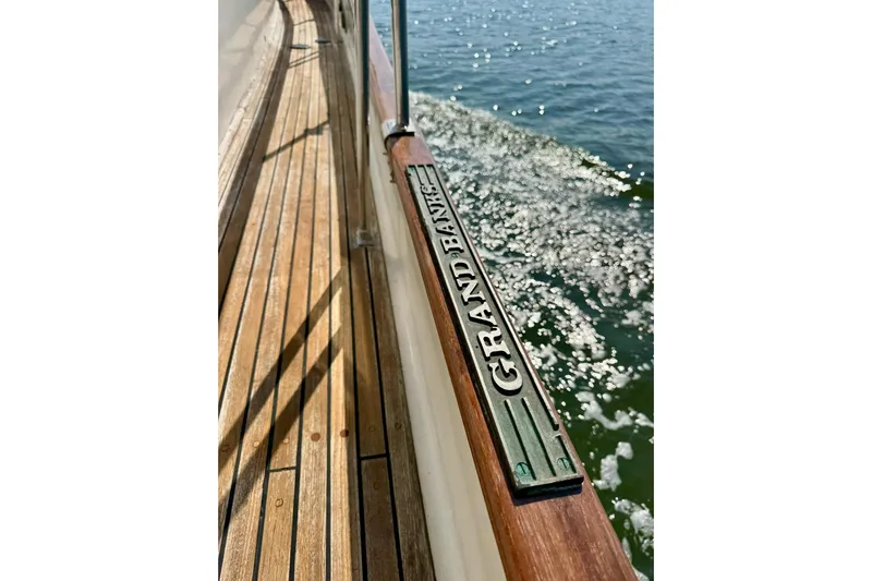  Yacht Photos Pics Wooden deck of 1990 Grand Banks 36 Classic yacht with water view.
