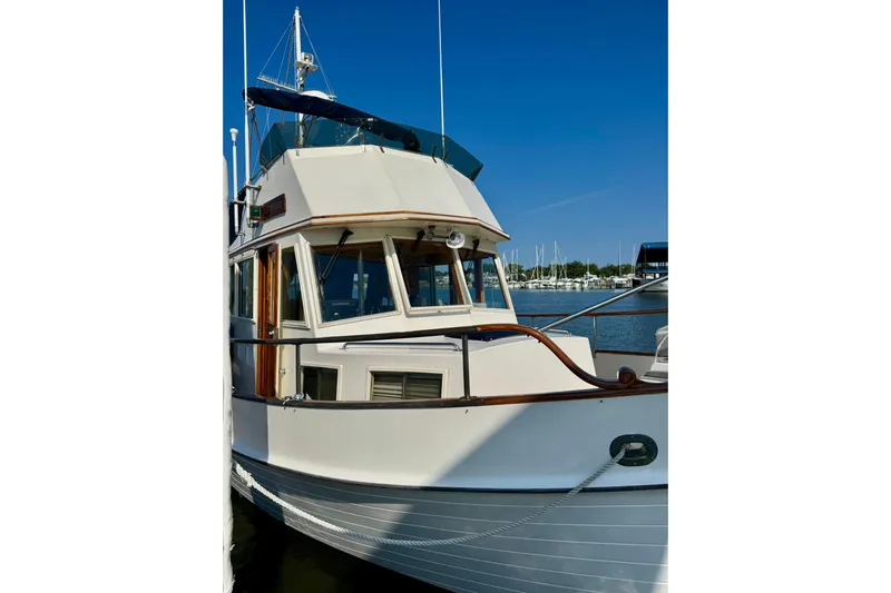  Yacht Photos Pics 1990 Grand Banks 36 Classic yacht docked at marina under clear blue sky.