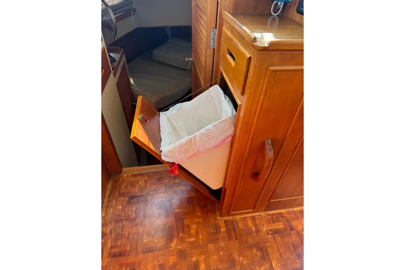  Yacht Photos Pics Wooden interior of 1990 Grand Banks 36 Classic with pull-out trash bin.