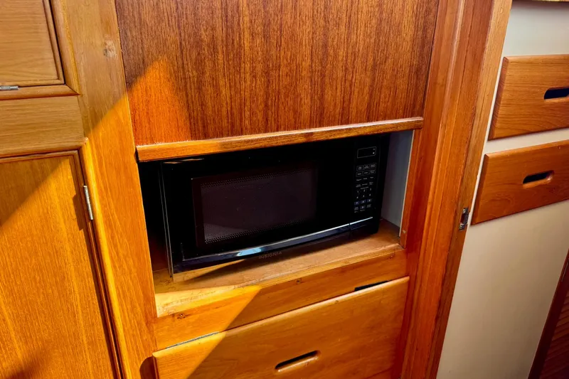  Yacht Photos Pics Wooden interior of 1990 Grand Banks 36 Classic with built-in microwave.
