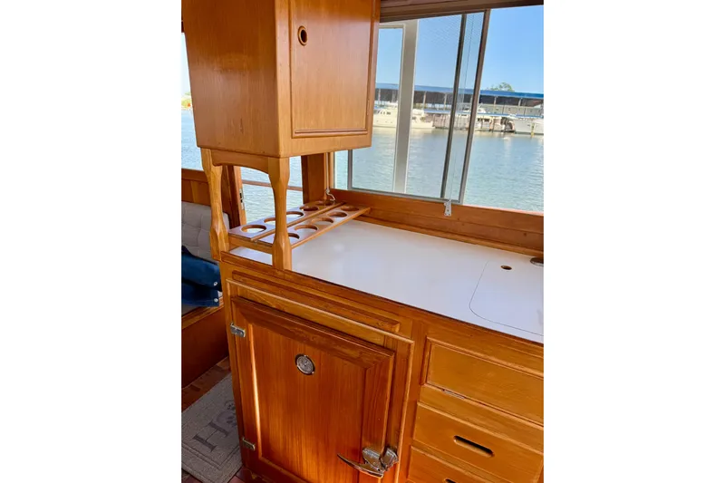  Yacht Photos Pics Interior of 1990 Grand Banks 36 Classic yacht with wooden cabinetry and water view.