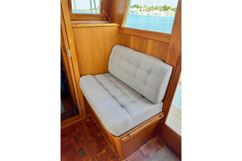  Yacht Photos Pics Cozy seating area on 1990 Grand Banks 36 Classic yacht with wooden interior.