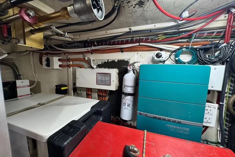  Yacht Photos Pics Engine room of 1990 Grand Banks 36 Classic with electrical components and fire extinguisher.