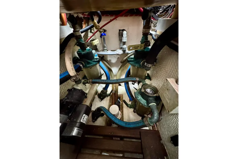  Yacht Photos Pics Engine room of 1990 Grand Banks 36 Classic with visible pumps and hoses.