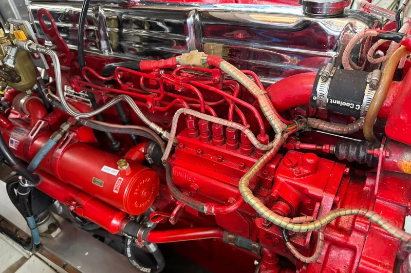  Yacht Photos Pics Engine of a 1990 Grand Banks 36 Classic, featuring red components and intricate wiring.