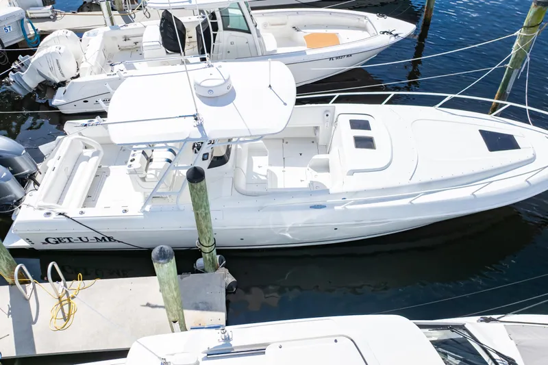  Yacht Photos Pics 2003 Intrepid 370 Cuddy boat docked at marina, aerial view.
