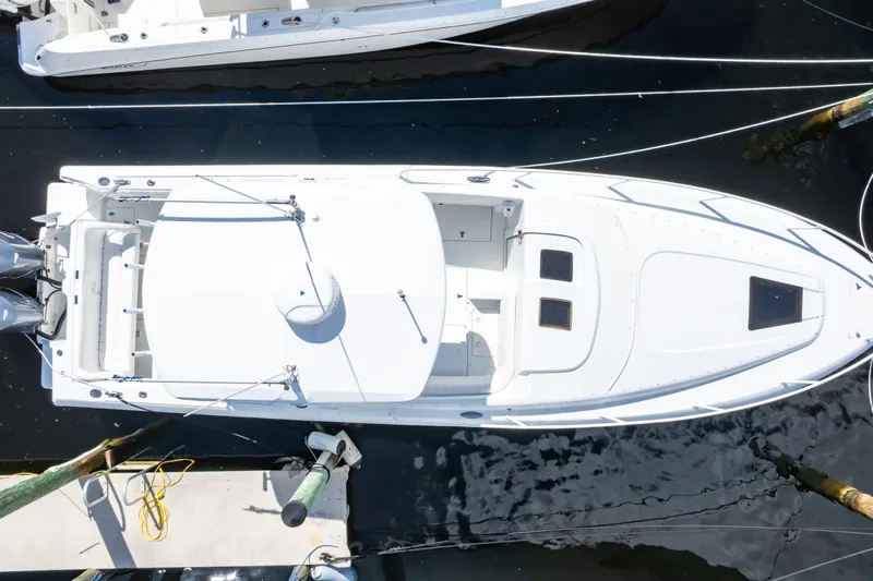  Yacht Photos Pics Aerial view of 2003 Intrepid 370 Cuddy boat docked at marina.