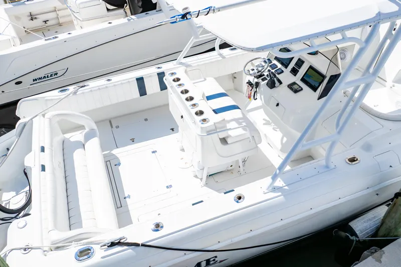  Yacht Photos Pics 2003 Intrepid 370 Cuddy boat interior with seating and control panel.