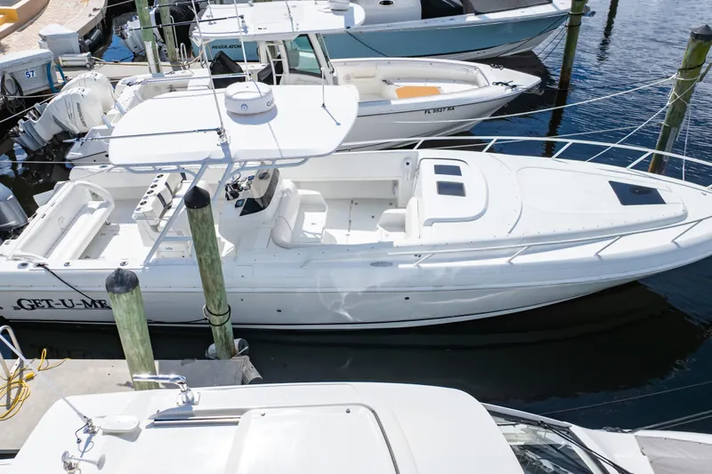 Yacht Photos Pics 2003 Intrepid 370 Cuddy boat docked at marina, aerial view.