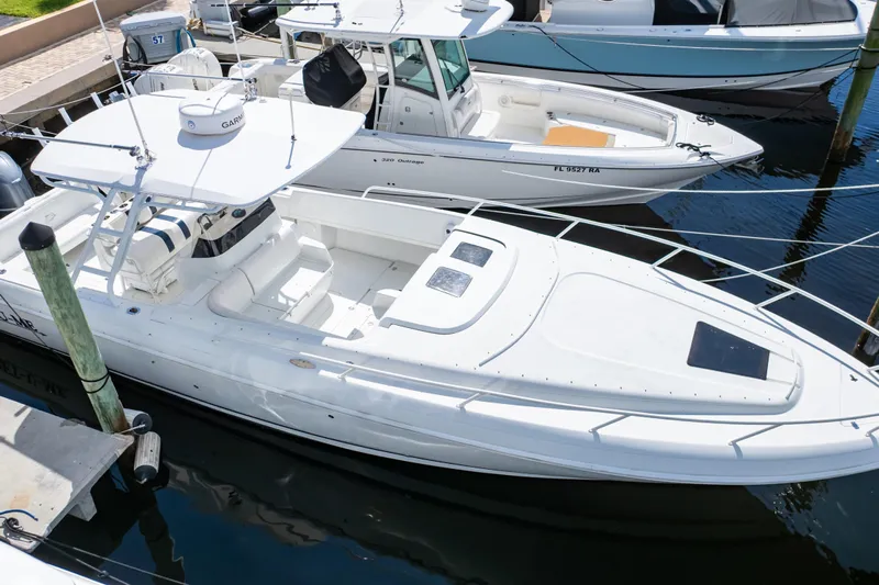  Yacht Photos Pics 2003 Intrepid 370 Cuddy boat docked in marina, aerial view.