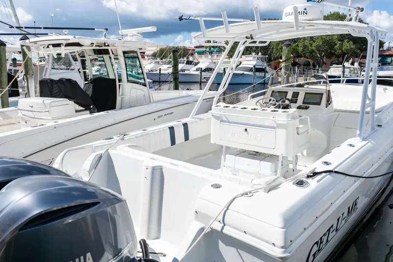  Yacht Photos Pics 2003 Intrepid 370 Cuddy boat docked, featuring dual Yamaha engines and spacious cockpit.