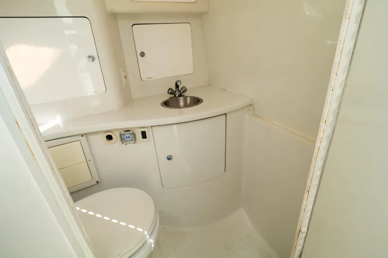  Yacht Photos Pics 2003 Intrepid 370 Cuddy boat bathroom with sink and toilet.