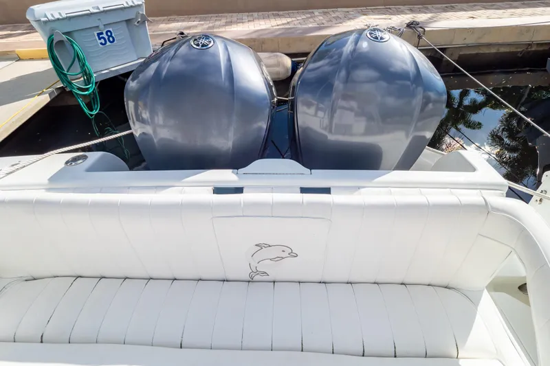  Yacht Photos Pics 2003 Intrepid 370 Cuddy boat with twin engines and white seating.