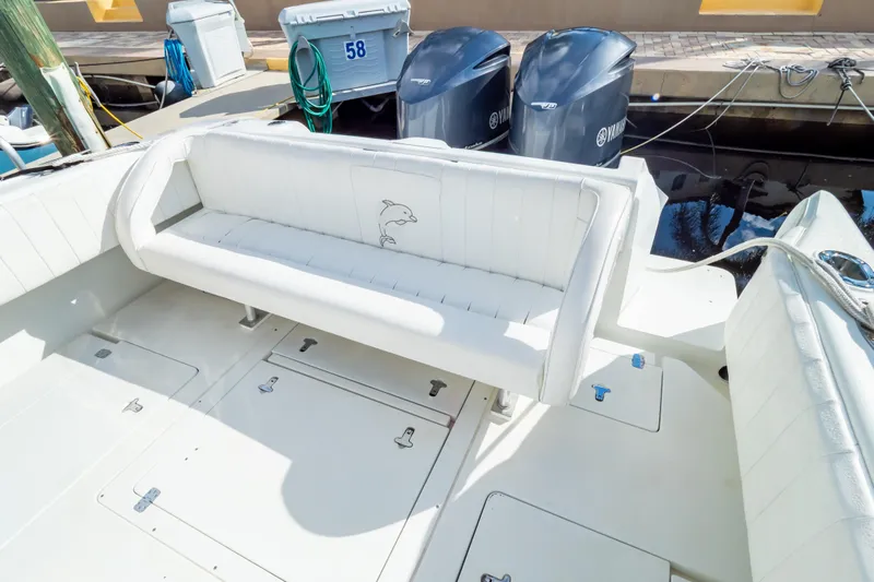  Yacht Photos Pics 2003 Intrepid 370 Cuddy boat interior with white seating and Yamaha engines.