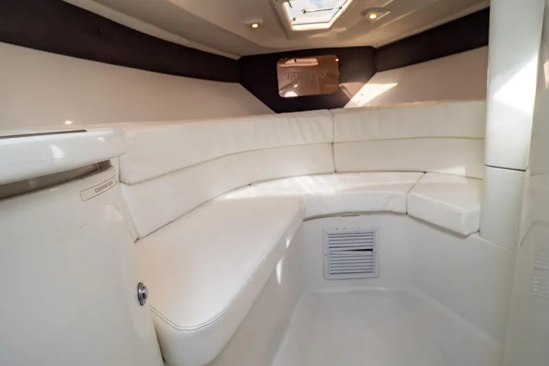  Yacht Photos Pics 2003 Intrepid 370 Cuddy interior with white seating and overhead lighting.